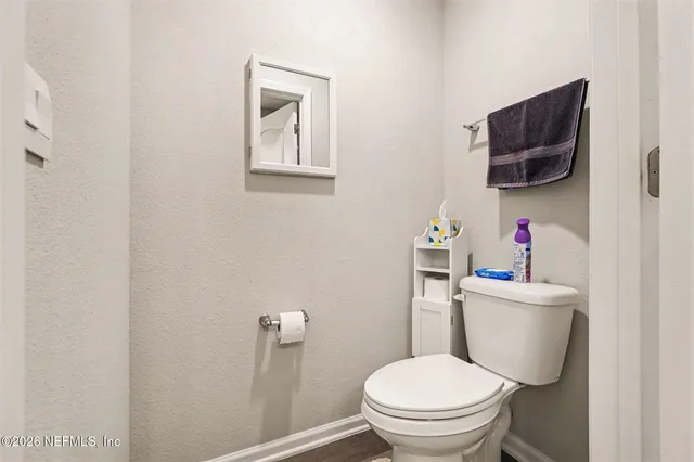 a bedroom with a bed and a closet