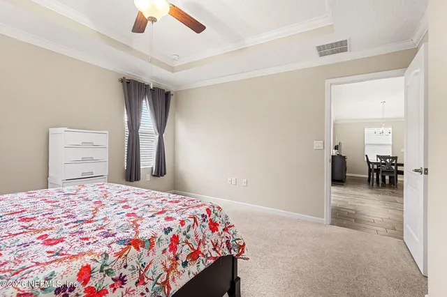 a en suite bathroom with double sink and a mirror