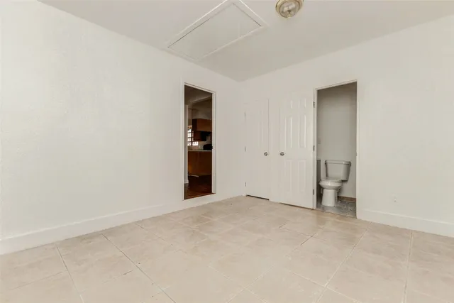 a view of an empty room with a closet