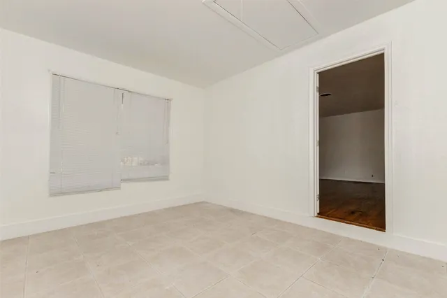 an empty room with a bathroom