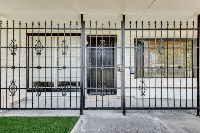 a view of a balcony with fence