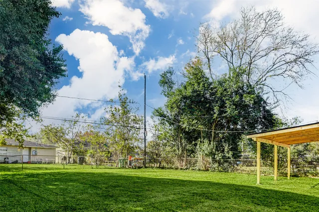 a view of a house with a big yard