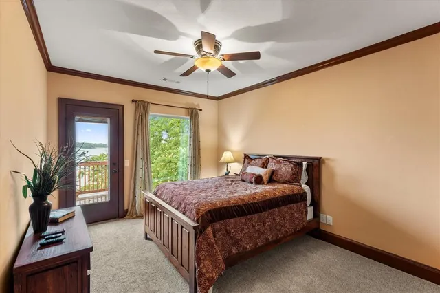 a bedroom with a bed next to a window