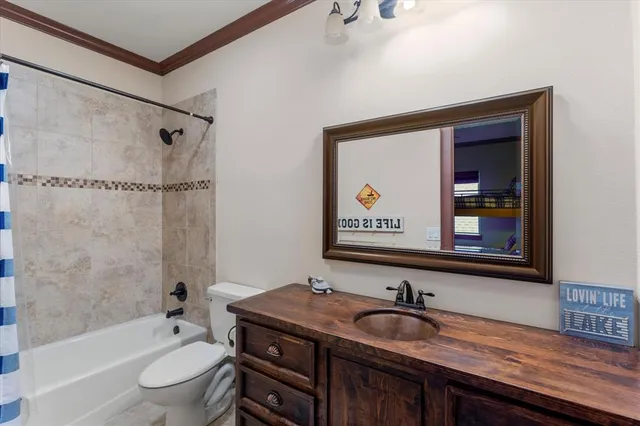 a bathroom with a granite countertop sink a large mirror and a bathtub
