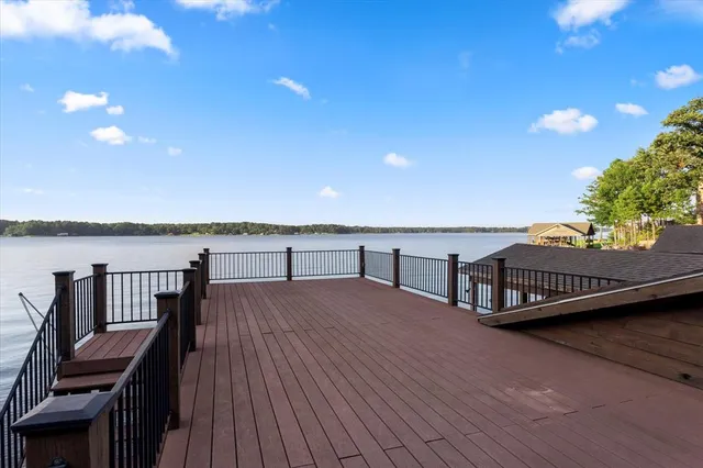 a view of balcony with wooden floor and seating space