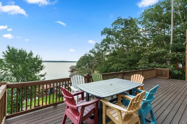 a view of a table and chairs on the roof deck