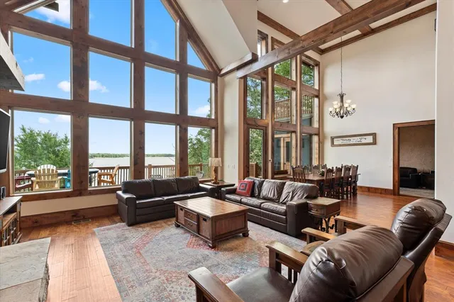 a living room with furniture and large windows