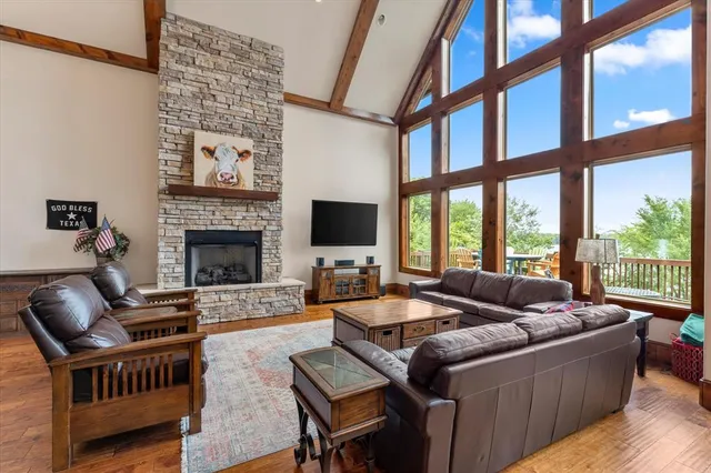 a living room with furniture fireplace and a flat screen tv