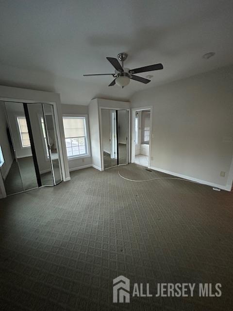 11 Pleasant Plains Road Franklin Park, NJ 08823 - Photo 4 of 8 en empty room with windows and ceiling fan