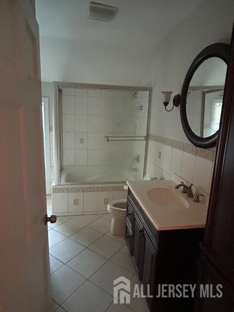11 Pleasant Plains Road Franklin Park, NJ 08823 - Photo 6 of 8 a bathroom with a sink a toilet and a mirror