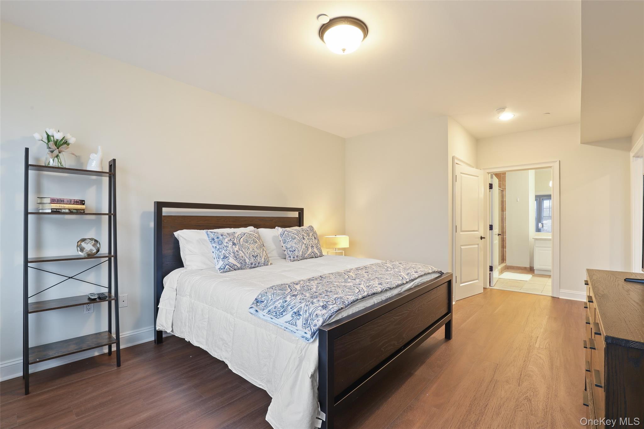 10 School Street, Unit 3F Rye, NY 10580 - Photo 3 of 6 a spacious bedroom with a bed and a table