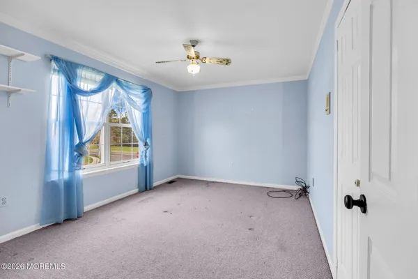 a view of an empty room with glass door