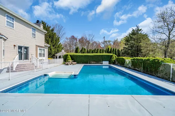 a view of a swimming pool with a patio