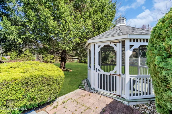 a view of a garden with wooden fence