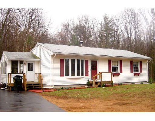 220 Arnold Road Sturbridge, MA 01518 - Photo 1 of 1 a front view of a house with garden