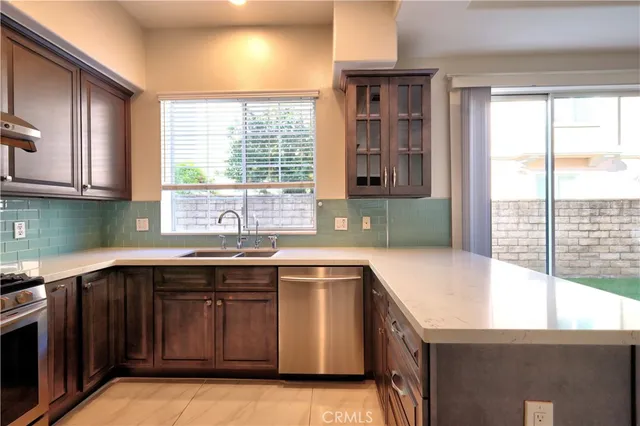 a bathroom with a granite countertop toilet sink and mirror