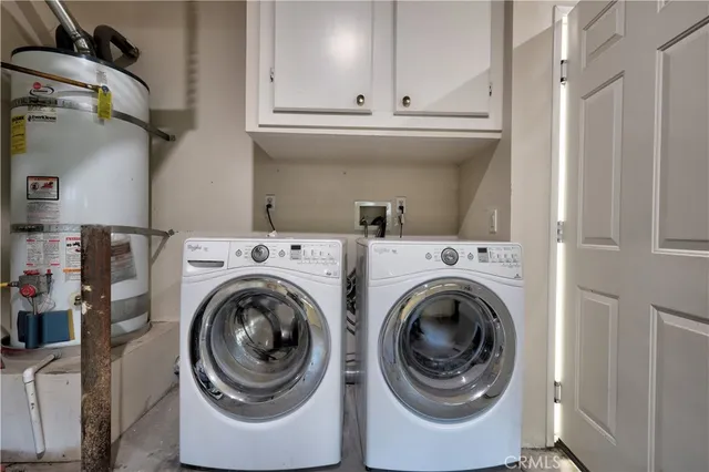 an aerial view of residential houses with outdoor space and swimming pool
