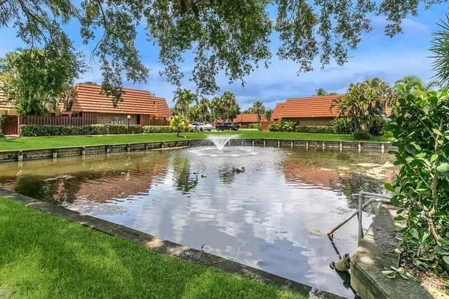 a view of a lake with a house in the background