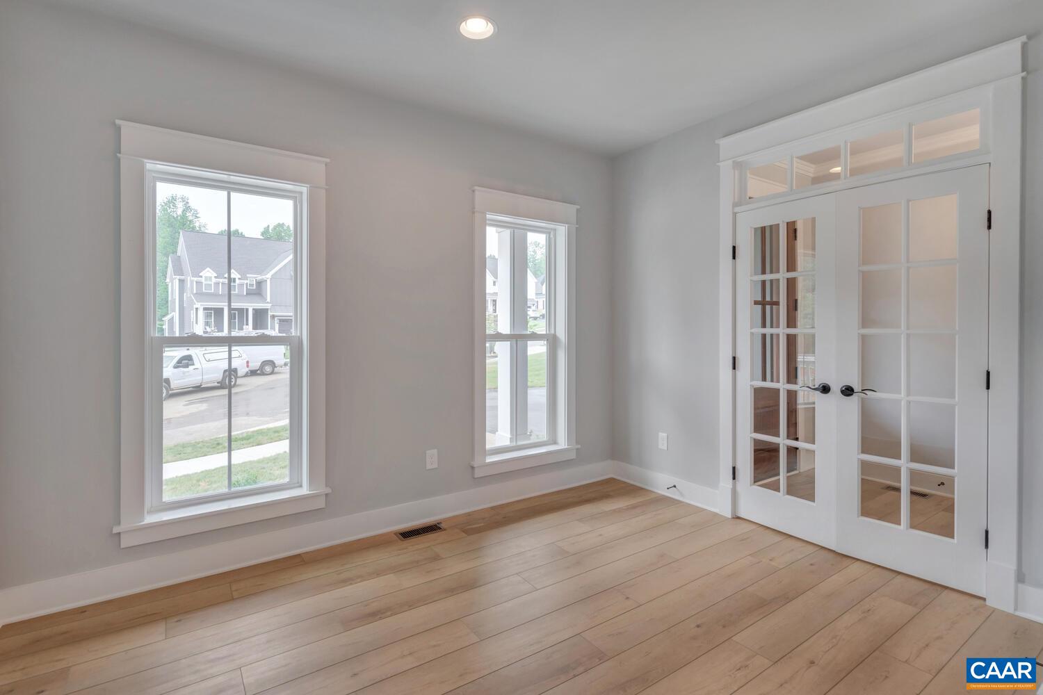 169 Agatha Ridge Lane Crozet, VA 22932 - Photo 19 of 73 an empty room with wooden floor and windows