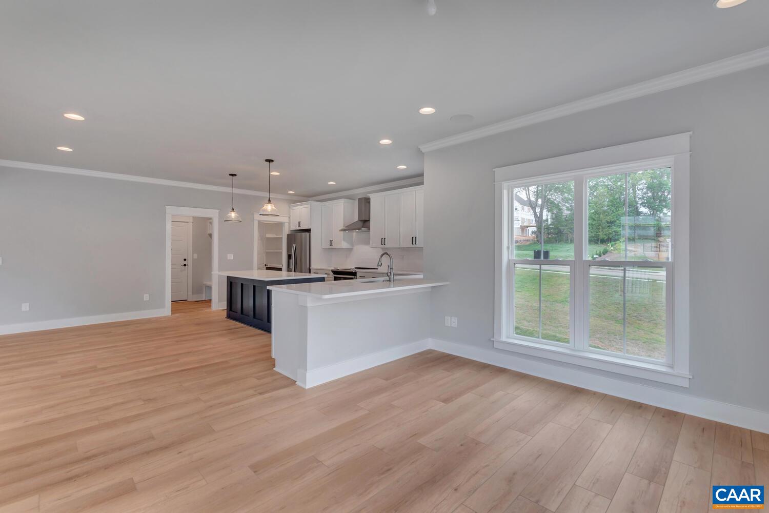 169 Agatha Ridge Lane Crozet, VA 22932 - Photo 29 of 73 a view of kitchen with kitchen island wooden floor and center island