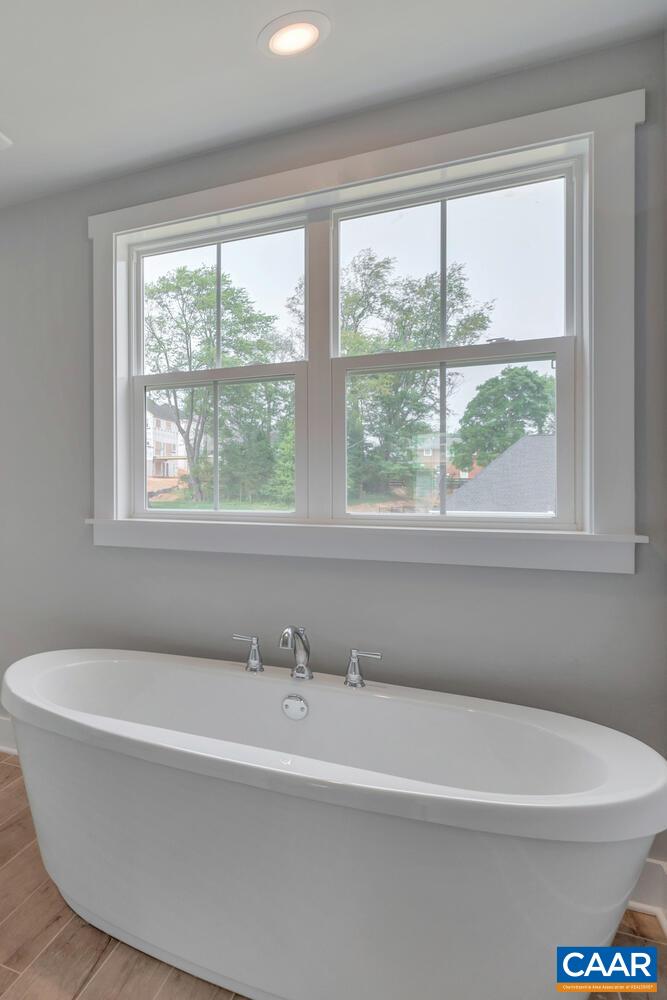 169 Agatha Ridge Lane Crozet, VA 22932 - Photo 42 of 73 a white bath tub sitting under a bathroom next to a window