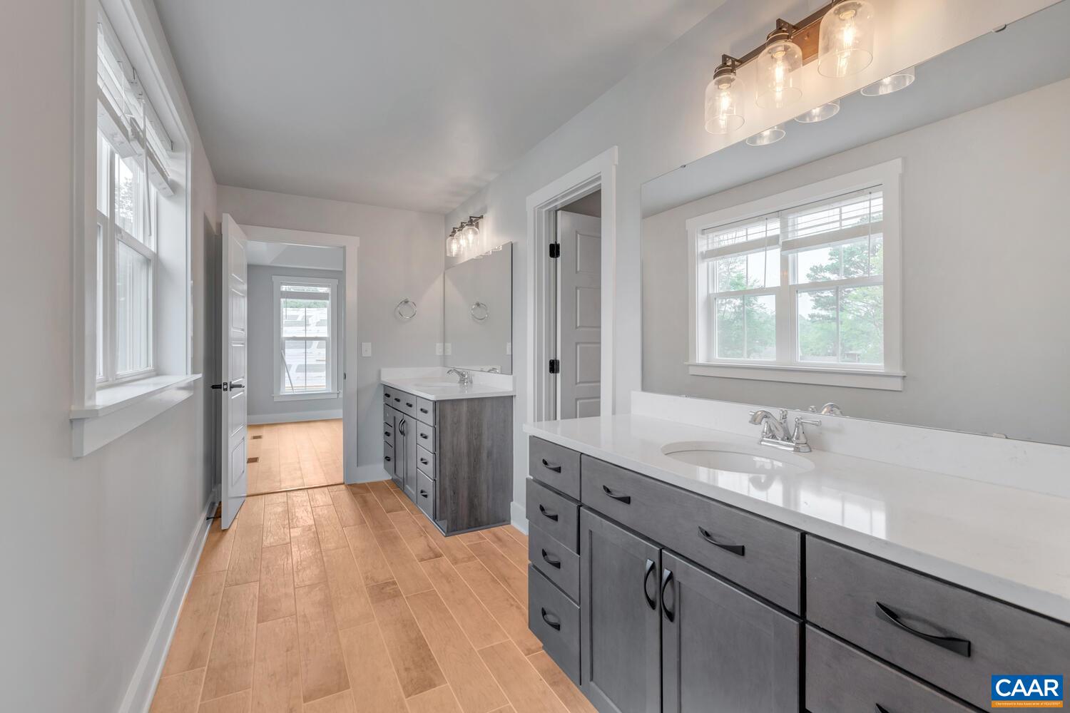 169 Agatha Ridge Lane Crozet, VA 22932 - Photo 46 of 73 a spacious bathroom with a granite countertop sink mirror and a bath tub