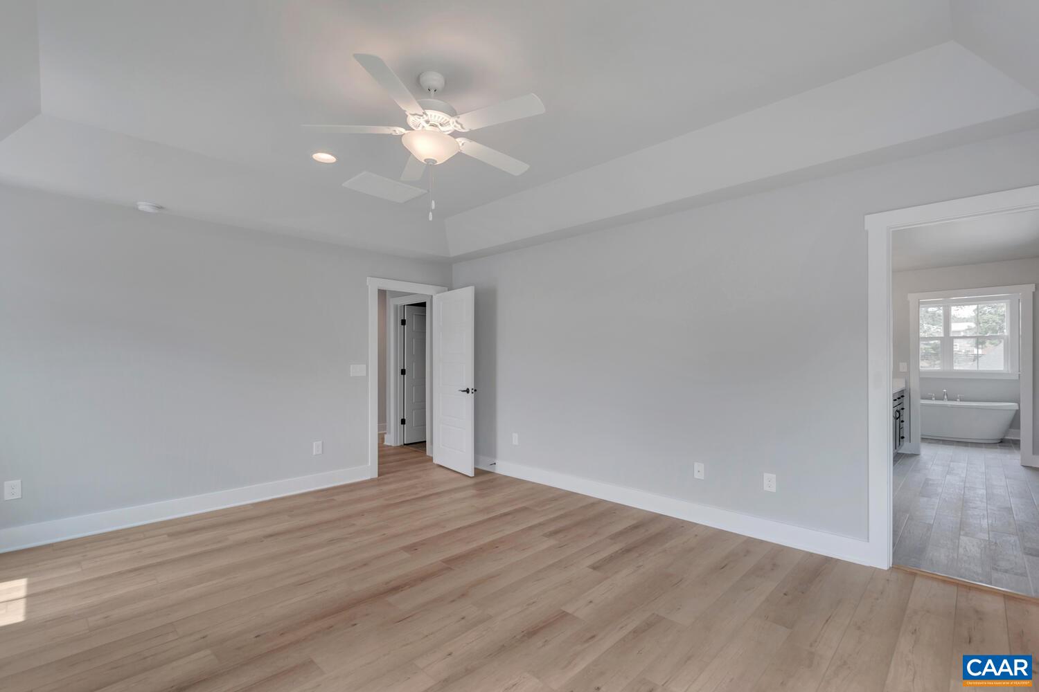 169 Agatha Ridge Lane Crozet, VA 22932 - Photo 48 of 73 a view of an empty room with wooden floor and a window