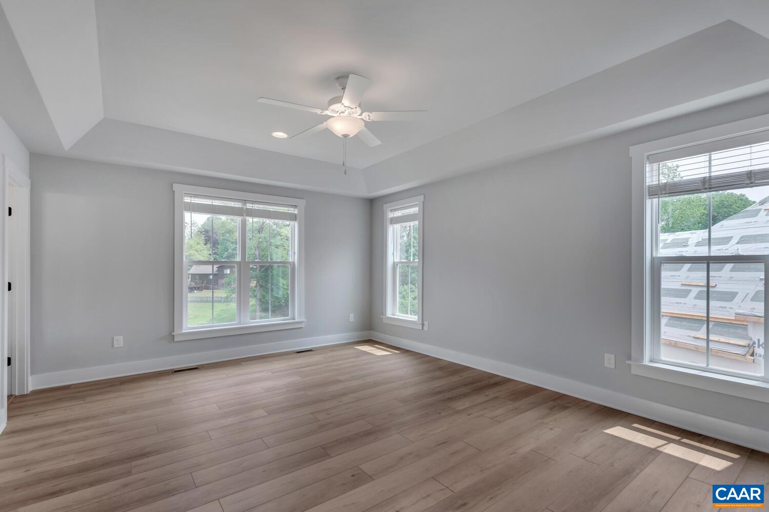 169 Agatha Ridge Lane Crozet, VA 22932 - Photo 49 of 73 a view of an empty room with wooden floor and a window