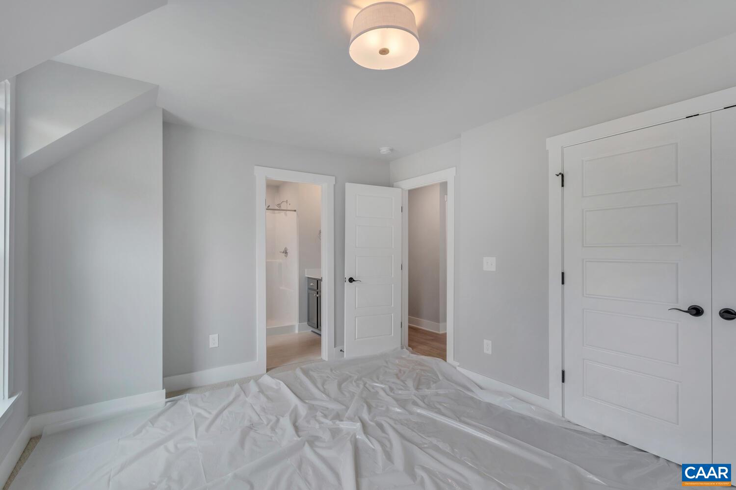 169 Agatha Ridge Lane Crozet, VA 22932 - Photo 51 of 73 a view of a room with wooden floor and mirror