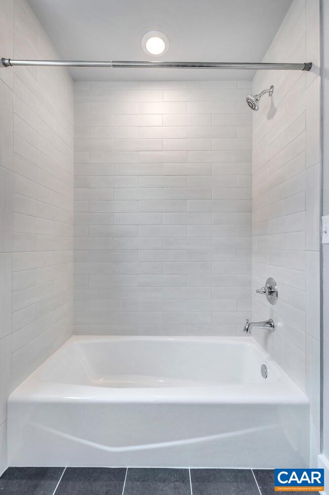 169 Agatha Ridge Lane Crozet, VA 22932 - Photo 56 of 73 a bathroom with a shower and a bath tub