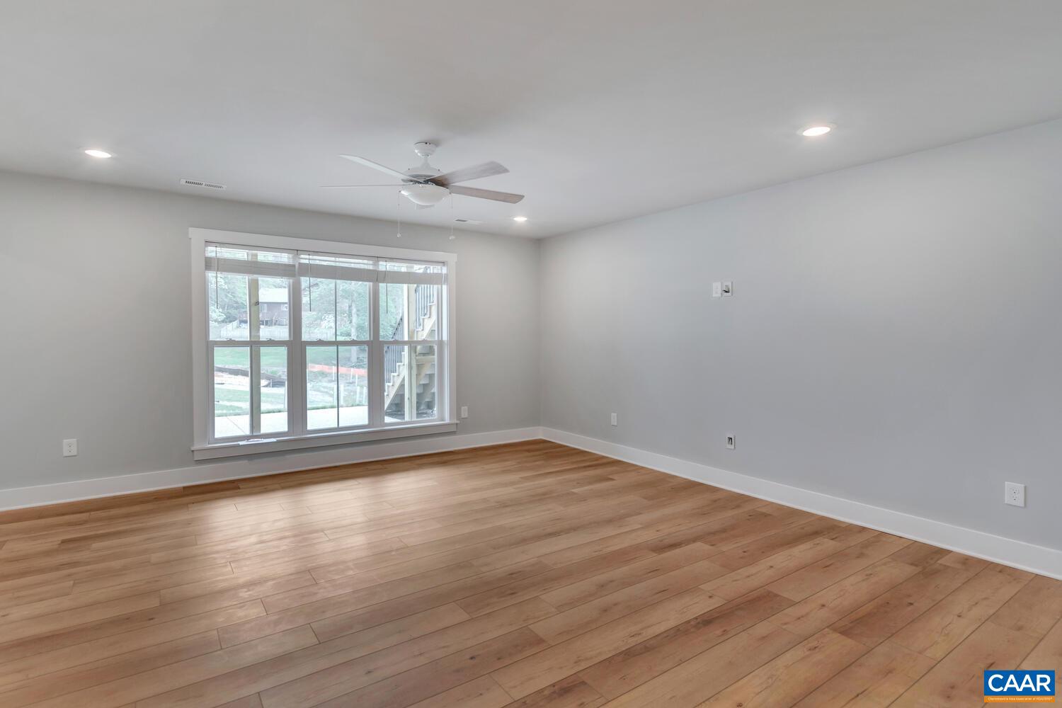 169 Agatha Ridge Lane Crozet, VA 22932 - Photo 66 of 73 a view of an empty room with wooden floor and a window