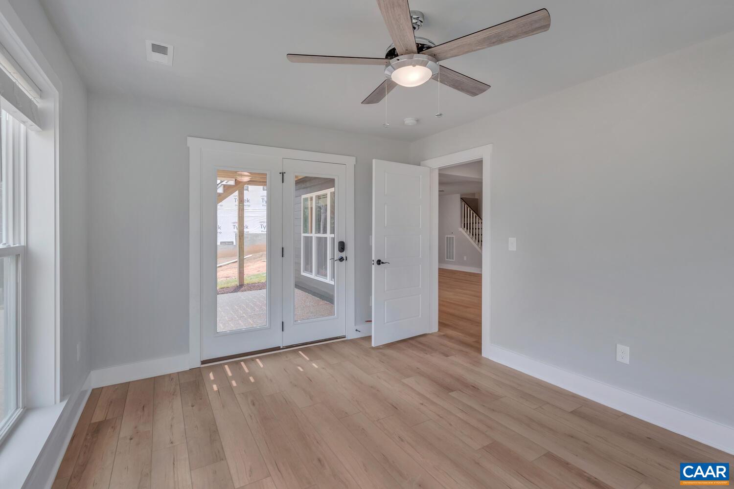 169 Agatha Ridge Lane Crozet, VA 22932 - Photo 70 of 73 a view of empty room with wooden floor and fan