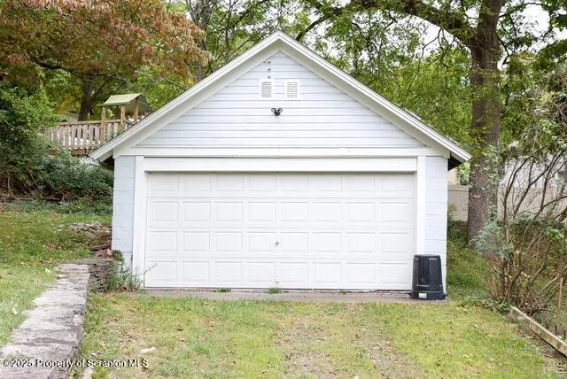 an empty room with wooden floor and a window