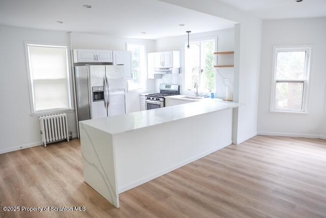 220 Clark Avenue Clarks Summit, PA 18411 - Photo 12 of 25 a large kitchen with kitchen island a sink stainless steel appliances and cabinets