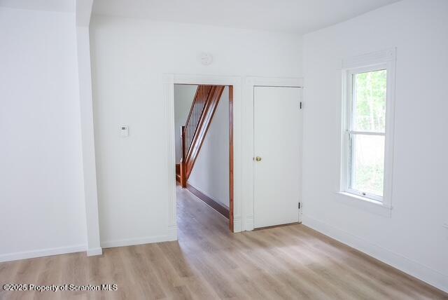 220 Clark Avenue Clarks Summit, PA 18411 - Photo 13 of 25 an empty room with wooden floor and a window