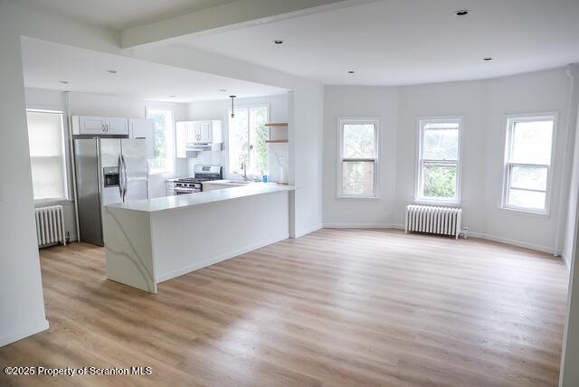 220 Clark Avenue Clarks Summit, PA 18411 - Photo 14 of 25 a view of a kitchen with furniture and wooden floor