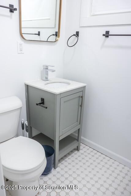 220 Clark Avenue Clarks Summit, PA 18411 - Photo 16 of 25 a bathroom with a toilet a sink and mirror