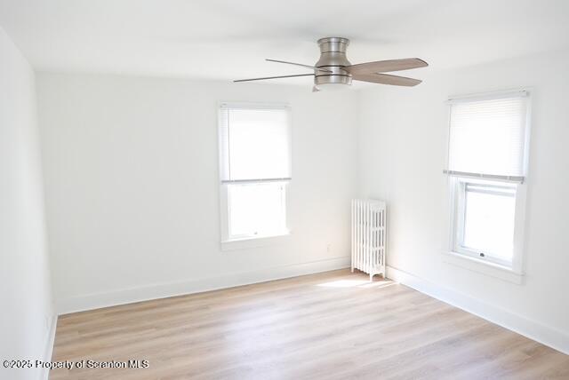 220 Clark Avenue Clarks Summit, PA 18411 - Photo 18 of 25 an empty room with wooden floor fan and windows