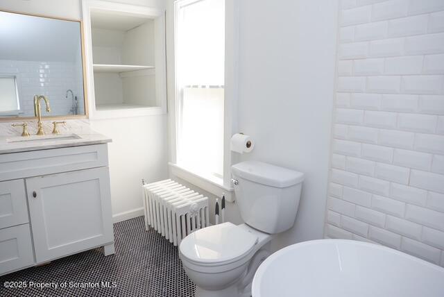 220 Clark Avenue Clarks Summit, PA 18411 - Photo 19 of 25 a bathroom with a toilet a sink and a mirror