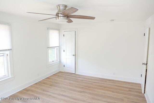 220 Clark Avenue Clarks Summit, PA 18411 - Photo 21 of 25 an empty room with wooden floor fan and windows