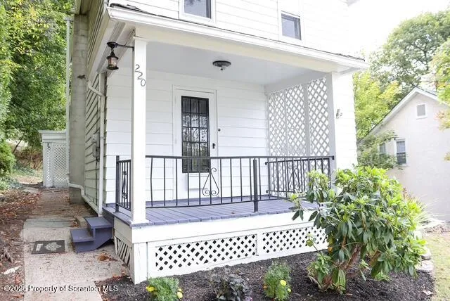 a view of small house with backyard space