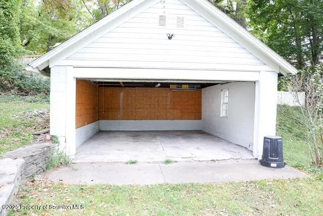 a large kitchen with kitchen island a sink stainless steel appliances and cabinets