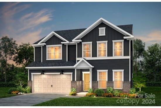 1558 Respect Street Northwest, Unit 73 Concord, NC 28027 - Photo 1 of 1 a front view of a house with a yard