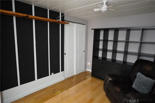 a bed room with a bed window and closet