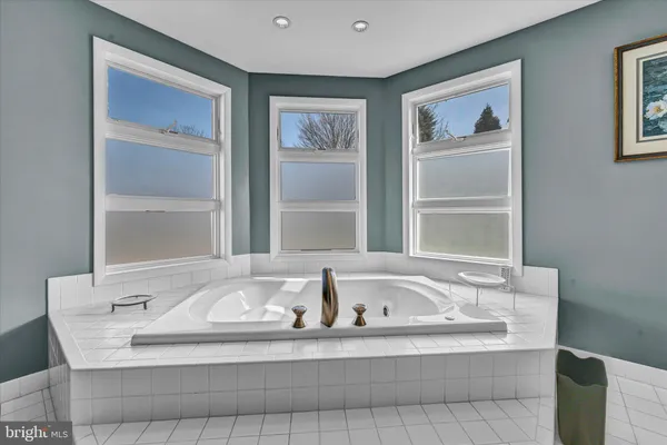 a bathroom with a sink vanity and mirror