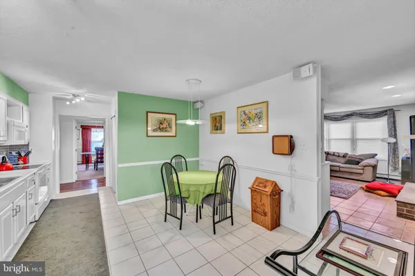 a view of a livingroom with furniture and a table