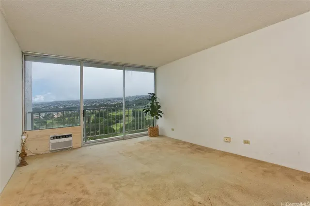 a view of an empty room with a balcony