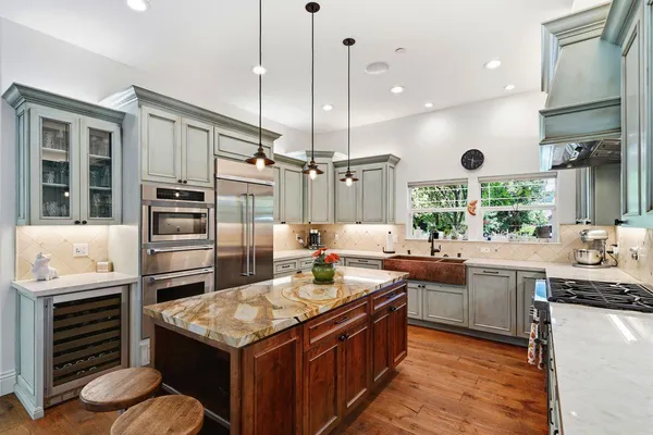 a kitchen with a stove and a sink