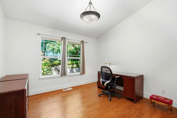 a room with furniture and a ceiling fan