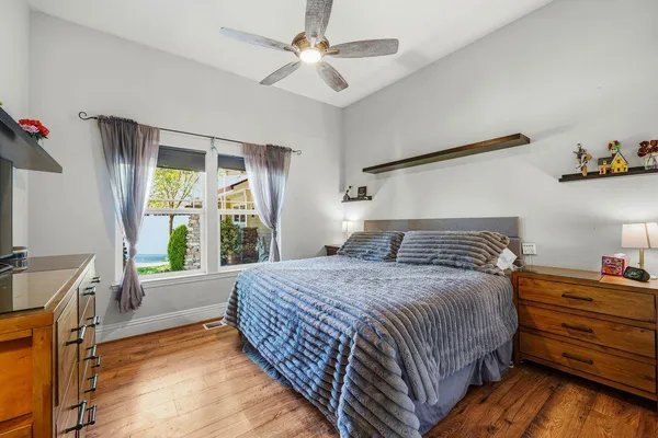 a bedroom with furniture and flat screen tv